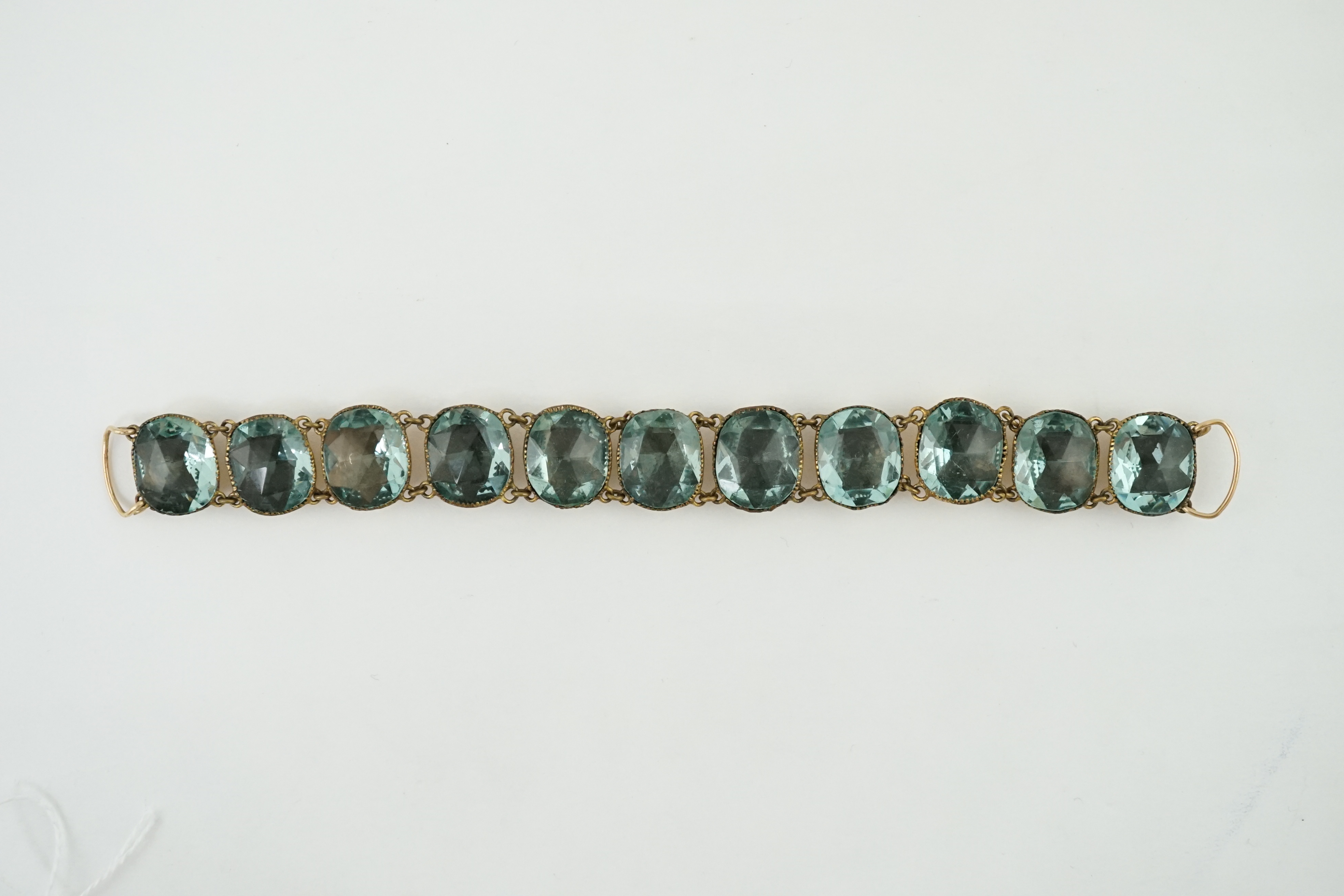 A rare 18th century 'Queen Anne' gilt metal and foil backed aquamarine paste bracelet